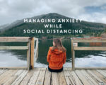 managing anxiety while social distancing graphic with woman sitting on dock and mountains in background